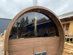 Деревянная баня бочка с панорамным окном из ольхового бруса 6,0х2.15 под ключ