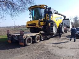 Перевозка комбайна New Holland TС5080 с жатками до 9 метров включительно. Заказать трал