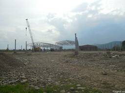 Строительство завода по обработке древесины.